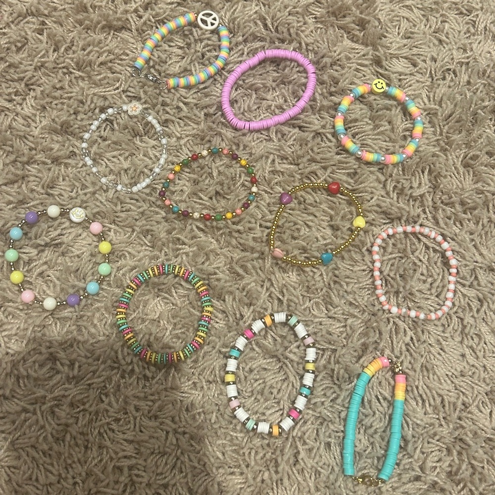 10 peice multicolored cute braclets, great as gifts.